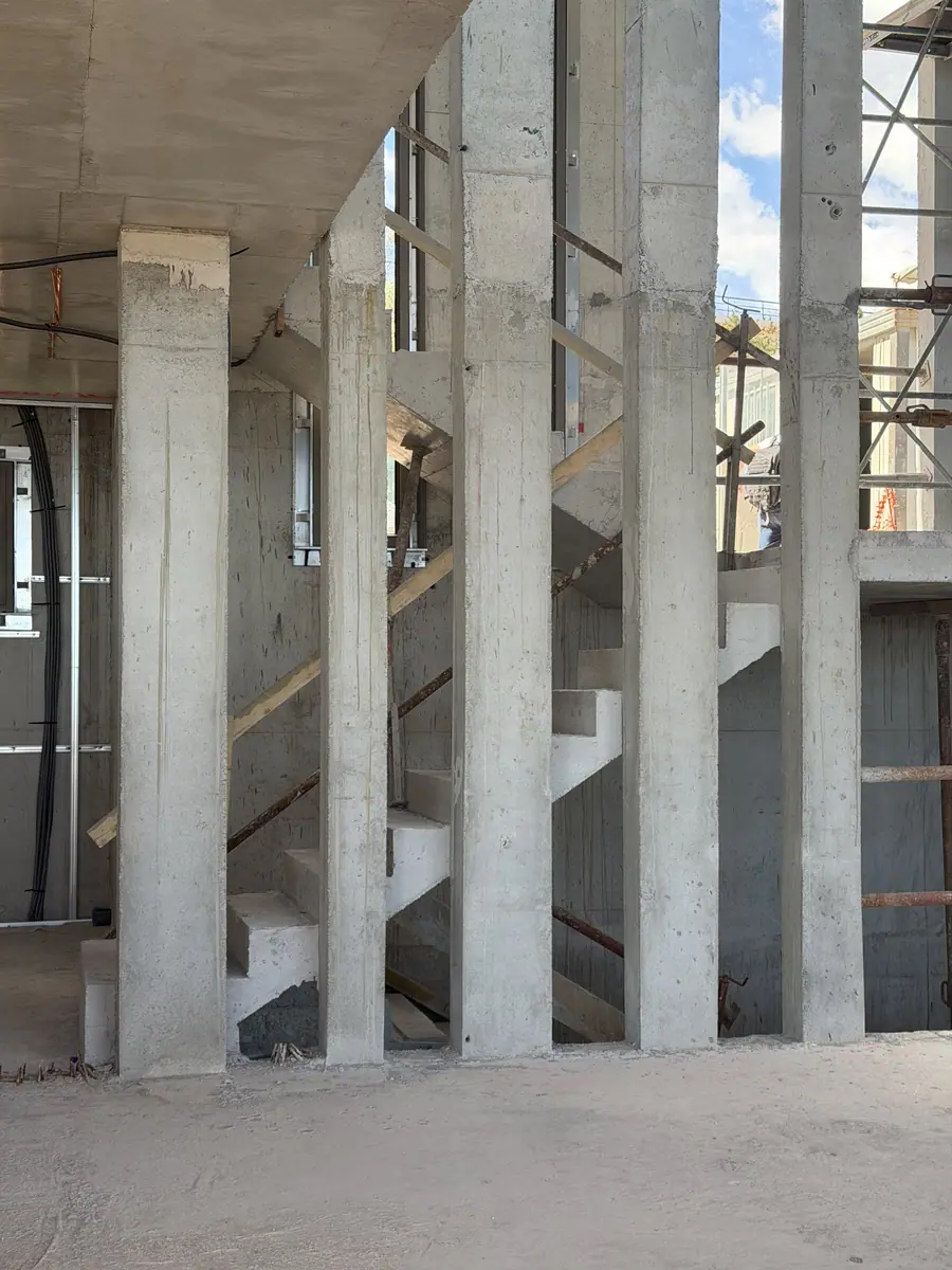 Cast-in-place concrete columns and stair, with propping and scaffolding in place