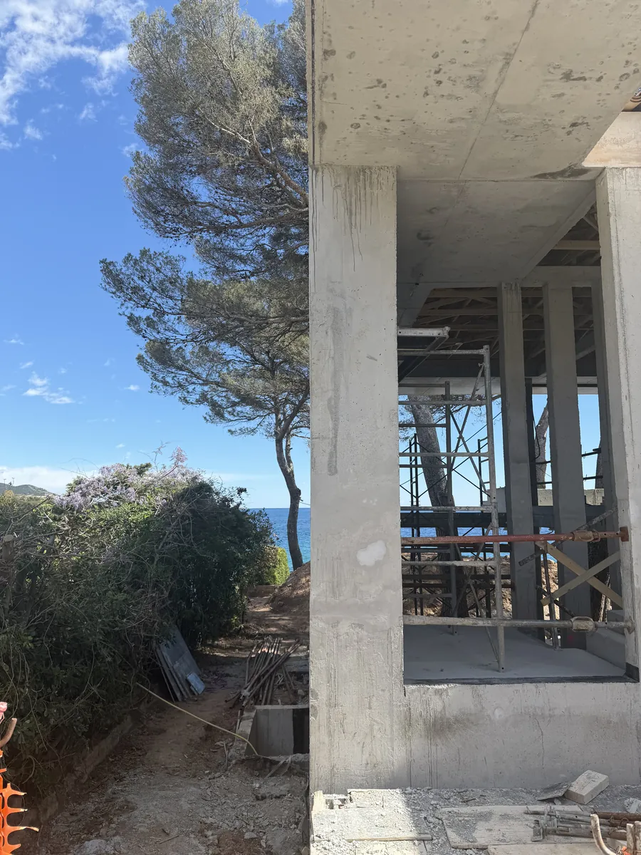 Propped concrete structure facing the sea, villa under construction