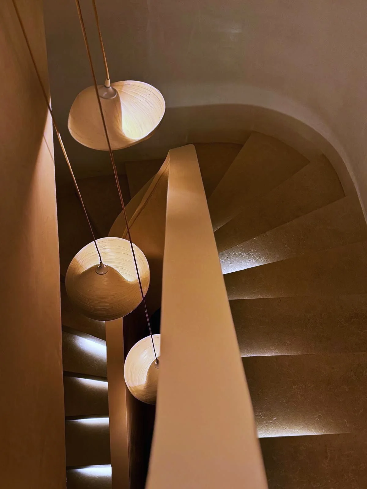 Helical travertine staircase